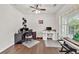 Well-lit office provides ample space for desks and computer equipment, perfect for a home-based business at 5008 Bethpage Dr, Suwanee, GA 30024