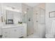 Modern bathroom featuring a glass shower, white vanity, and clean lines for a spa-like experience at 120 Nezhat Pl, Atlanta, GA 30350