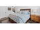 Cozy bedroom featuring a decorative headboard, soft blue linens, and a warm and inviting atmosphere at 120 Nezhat Pl, Atlanta, GA 30350