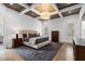 A luxurious main bedroom featuring stylish furniture, a decorative ceiling, and hardwood flooring at 120 Nezhat Pl, Atlanta, GA 30350