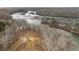 A serene aerial view showcases the natural beauty of the land around the river at 120 Nezhat Pl, Sandy Springs, GA 30350