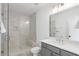 Bathroom featuring a glass shower with a built-in seat, modern tile, and a vanity at 120 Nezhat Pl, Sandy Springs, GA 30350