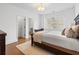 Bright bedroom featuring hardwood floors, a cozy rug, and natural light at 120 Nezhat Pl, Sandy Springs, GA 30350