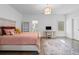 Bright bedroom with a plush bed, a desk, and an ensuite bathroom at 120 Nezhat Pl, Sandy Springs, GA 30350