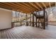 Large wooden deck with a wooded view at 120 Nezhat Pl, Sandy Springs, GA 30350