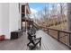 Expansive deck featuring dark wood, black railings, and multiple seating options for outdoor gatherings at 120 Nezhat Pl, Sandy Springs, GA 30350