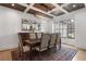 Cozy dining room featuring coffered ceilings, a chandelier, and seating for six at 120 Nezhat Pl, Sandy Springs, GA 30350