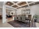 Inviting dining room open to living space, featuring coffered ceiling and ample seating at 120 Nezhat Pl, Sandy Springs, GA 30350