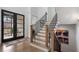 Elegant foyer with staircase, hardwood floors, and stylish double door entryway at 120 Nezhat Pl, Sandy Springs, GA 30350
