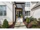 Inviting front entrance with double doors, brick facade, and manicured landscaping at 120 Nezhat Pl, Sandy Springs, GA 30350