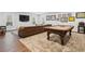 Well-lit game room features a classic pool table, leather couch, and ample room for entertaining at 120 Nezhat Pl, Sandy Springs, GA 30350