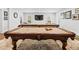 Bright game room with a pool table, large sofa, and recessed lighting at 120 Nezhat Pl, Sandy Springs, GA 30350