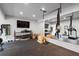 Large home gym complete with weights, cardio machines, and a mirrored wall at 120 Nezhat Pl, Sandy Springs, GA 30350