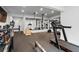 Bright home gym featuring a treadmill, weight equipment, and mirrored wall at 120 Nezhat Pl, Sandy Springs, GA 30350