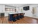 Kitchen island with seating, bar, white cabinets, and recessed lighting at 120 Nezhat Pl, Sandy Springs, GA 30350