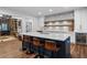 Modern kitchen features a large island, stainless steel appliances, and a stylish backsplash at 120 Nezhat Pl, Sandy Springs, GA 30350