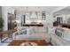 Bright, open kitchen featuring stainless steel appliances, a center island with seating, and white shaker cabinets at 120 Nezhat Pl, Sandy Springs, GA 30350