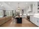 Spacious, modern kitchen features an island, stainless steel appliances, and white cabinetry at 120 Nezhat Pl, Sandy Springs, GA 30350