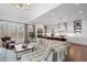 Open-concept living room featuring a spacious seating area, natural light, and a view into a modern kitchen with white cabinetry at 120 Nezhat Pl, Sandy Springs, GA 30350
