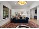 Cozy living room with view to the kitchen and breakfast area at 120 Nezhat Pl, Sandy Springs, GA 30350