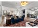Bright, open-concept living room with view of kitchen and dining room at 120 Nezhat Pl, Sandy Springs, GA 30350