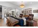 Open-concept living area with sightlines to kitchen, dining room, and staircase at 120 Nezhat Pl, Sandy Springs, GA 30350