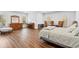Bright, spacious main bedroom with hardwood floors, large windows, and comfortable furnishings at 120 Nezhat Pl, Sandy Springs, GA 30350
