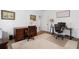 Bright home office features two desks, leather chair, and neutral tones at 120 Nezhat Pl, Sandy Springs, GA 30350