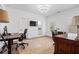 Office featuring hardwood floors, a TV, and lots of natural light at 120 Nezhat Pl, Sandy Springs, GA 30350