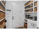 Organized pantry with ample shelving, storage baskets, and a convenient countertop appliance area at 120 Nezhat Pl, Sandy Springs, GA 30350