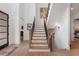 Open staircase with wood and iron railings, connecting the home's multiple levels at 120 Nezhat Pl, Sandy Springs, GA 30350