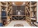 Stunning wine cellar with custom wood racking and display lighting at 120 Nezhat Pl, Sandy Springs, GA 30350