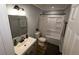 Updated bathroom featuring a vanity, toilet, and shower with a neutral color palette at 1563 Brannon Sw Cir, Austell, GA 30106