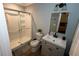 Clean bathroom with a glass-enclosed shower, a modern vanity, and neutral color scheme at 1563 Brannon Sw Cir, Austell, GA 30106