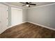 Bedroom features wood-look floors, double closet, and neutral wall color at 1563 Brannon Sw Cir, Austell, GA 30106