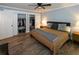 Cozy bedroom with hardwood floors, a closet, ceiling fan, and neutral decor at 1563 Brannon Sw Cir, Austell, GA 30106