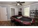 Entertainment room featuring a poker table, wood floors, natural lighting and shelving at 1563 Brannon Sw Cir, Austell, GA 30106