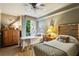 Cozy bedroom with two twin beds, a stone-accented window, and charming nature-themed decor at 2632 Peachtree Nw Rd # 203B, Atlanta, GA 30305