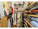 Walk-in closet with custom shelving, hanging rods, and ample storage for clothing and accessories at 2632 Peachtree Nw Rd # 203B, Atlanta, GA 30305