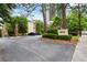 Well-maintained building exterior showcasing the address and mature landscaping at 2632 Peachtree Nw Rd # 203B, Atlanta, GA 30305