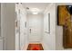 Entry hallway featuring a vibrant rug and artistic decor, leading to other areas at 2632 Peachtree Nw Rd # 203B, Atlanta, GA 30305