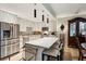 Bright eat-in kitchen with stainless appliances, granite countertops, and modern pendant lighting at 2632 Peachtree Nw Rd # 203B, Atlanta, GA 30305