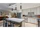 Open concept kitchen boasts an island with seating, stainless appliances, and ample storage at 2632 Peachtree Nw Rd # 203B, Atlanta, GA 30305