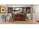 Elegant living room featuring custom built-in shelving with decorative accents and stylish furniture at 2632 Peachtree Nw Rd # 203B, Atlanta, GA 30305