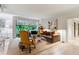 Bright living room with large windows, offering a comfortable seating arrangement and modern decor at 2632 Peachtree Nw Rd # 203B, Atlanta, GA 30305