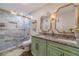 Beautifully designed bathroom with a double sink vanity, granite countertop, and a glass-enclosed tiled shower at 4100 Springlake Cir, Buford, GA 30519