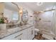 Modern bathroom showcasing double sinks, granite countertops, and a glass-enclosed shower at 4100 Springlake Cir, Buford, GA 30519