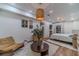 Relaxing bedroom with decorative lighting, a cozy chair, and view into an adjacent room at 4100 Springlake Cir, Buford, GA 30519