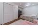Cozy bedroom with an area rug, closet and mounted television for relaxing evenings at 4100 Springlake Cir, Buford, GA 30519