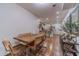 A well lit dining area connects to the kitchen with a wooden table and seating for six at 4100 Springlake Cir, Buford, GA 30519